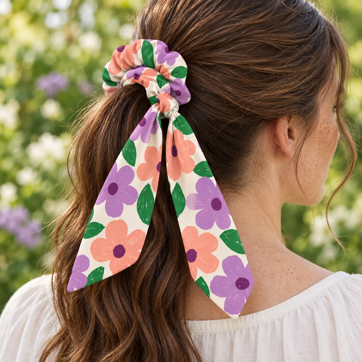 Bloom Party bow-tie scrunchie — worn view