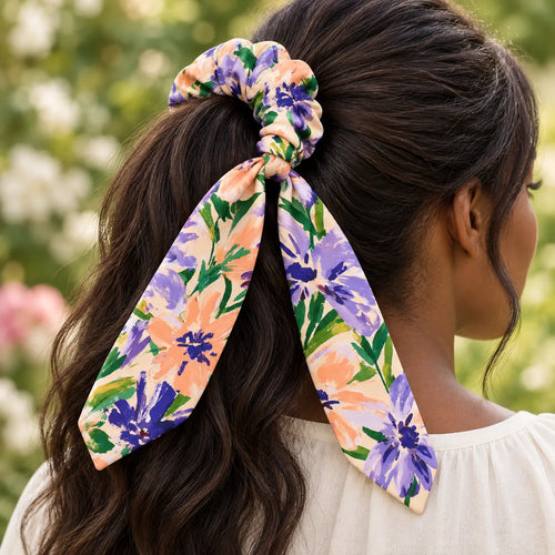 Bloom Riot bow-tie scrunchie — worn view