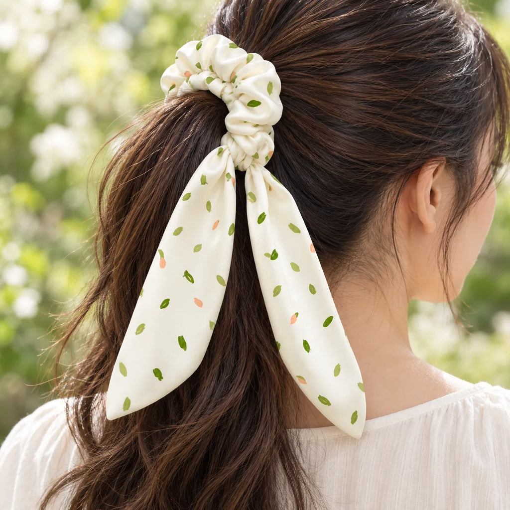 Leaf Whispers bow-tie scrunchie — worn view