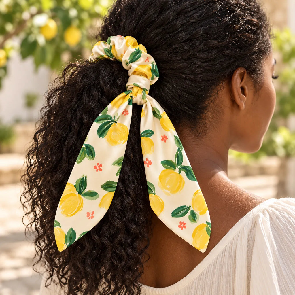 Lemon Picnic bow-tie scrunchie — worn view