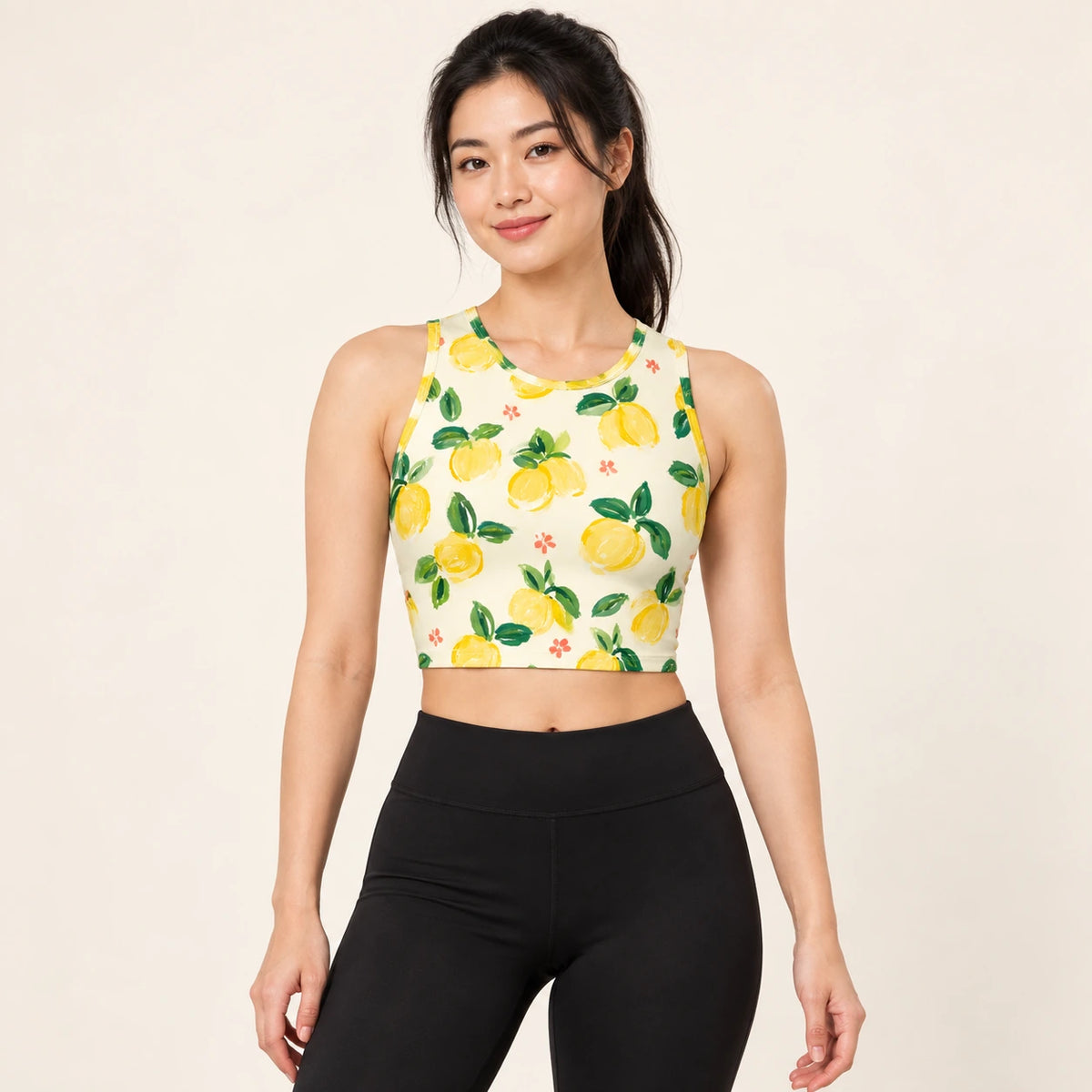 Lemon Picnic sports crop top — female hero view