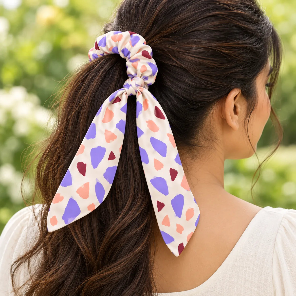 Lilac Terrazzo bow-tie scrunchie — worn view