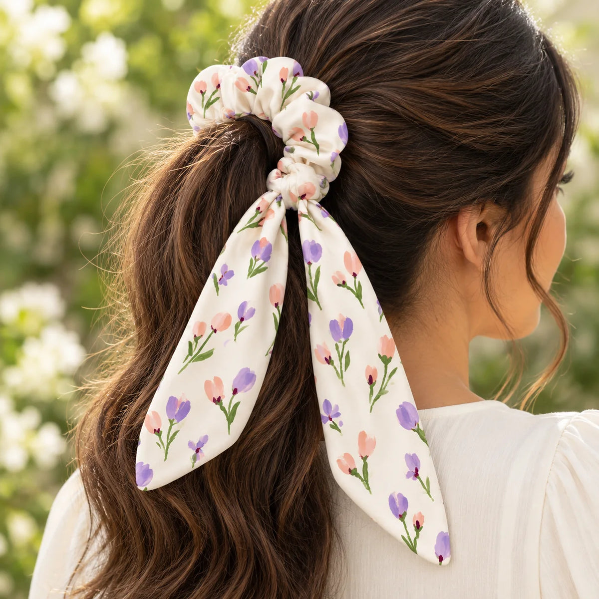 Little Buds bow-tie scrunchie — worn view