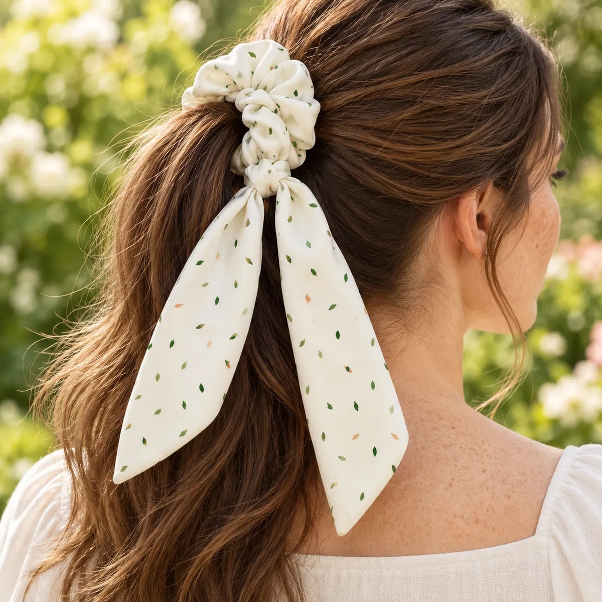 Meadow Dust bow-tie scrunchie — worn view