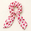 Pink Punctuation Bow-Tie Scrunchie — hero view
