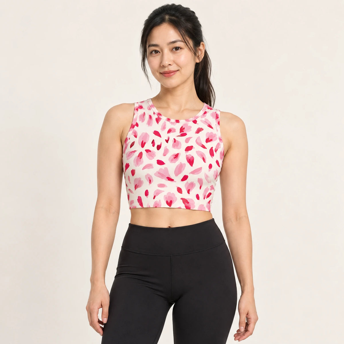 Pink Punctuation sports crop top — female hero view