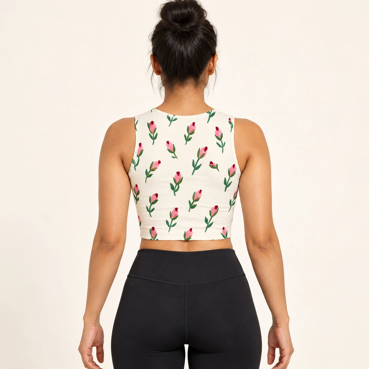 Rosebud Notes sports crop top — female back view
