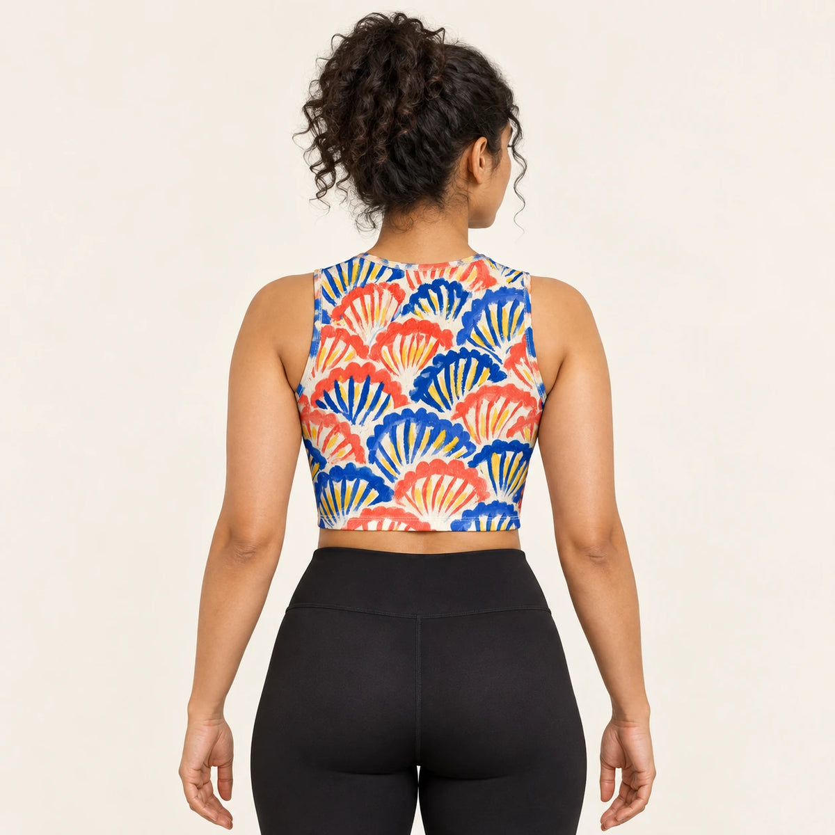 Shell Serenade sports crop top — female back view